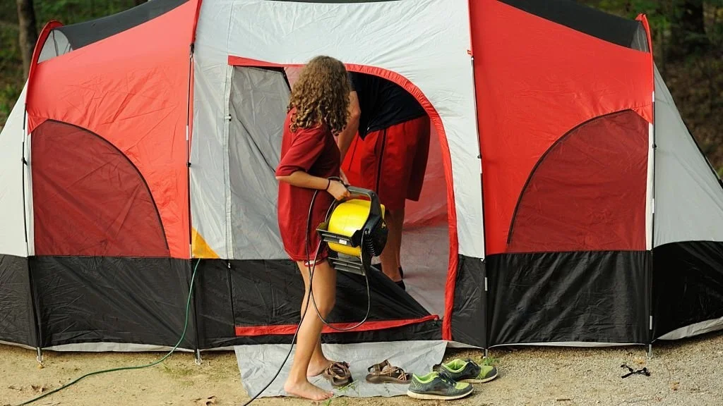 carrying an electric fan into the tent